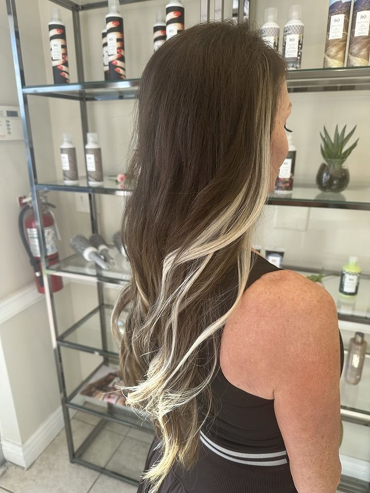 Platinum money-piece highlights on brunette waves