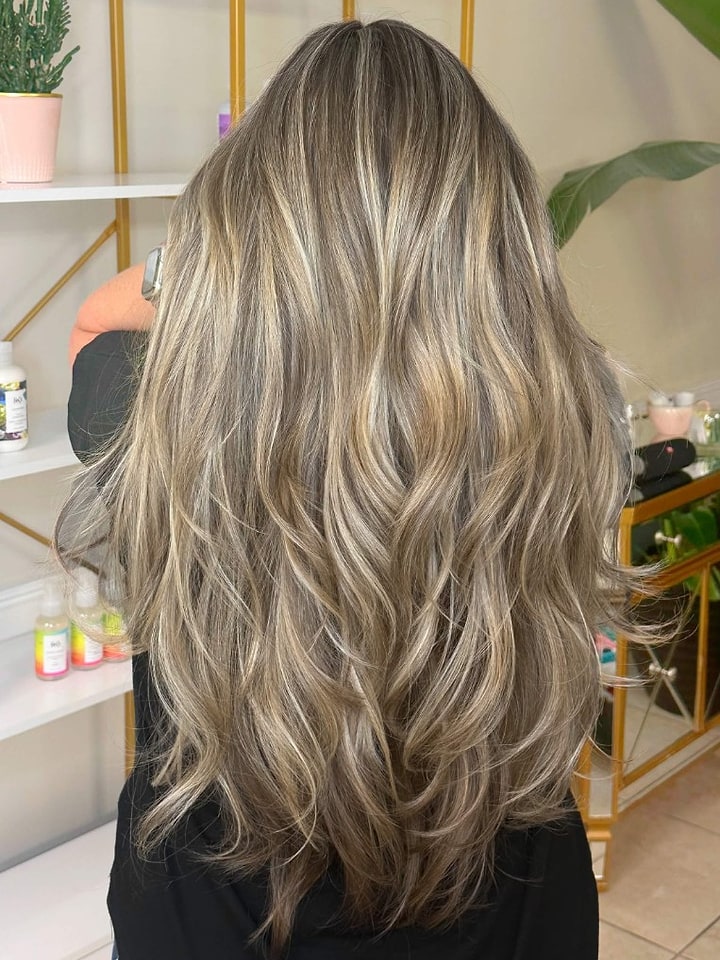 Dimensional blonde balayage with beach waves
