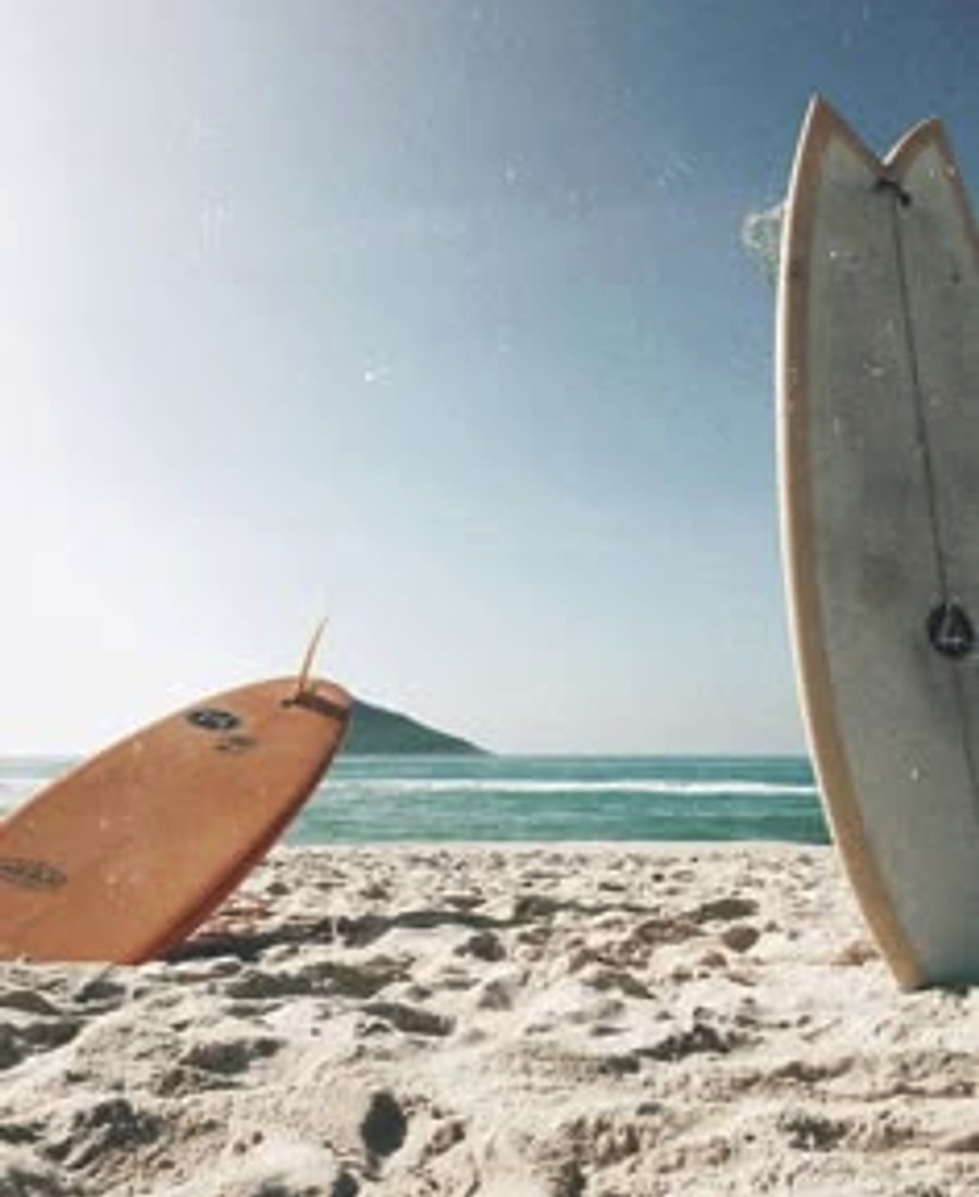Surfboards on the sand at the beach