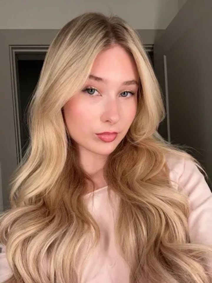 Bright blonde waves after a Salon Grace color