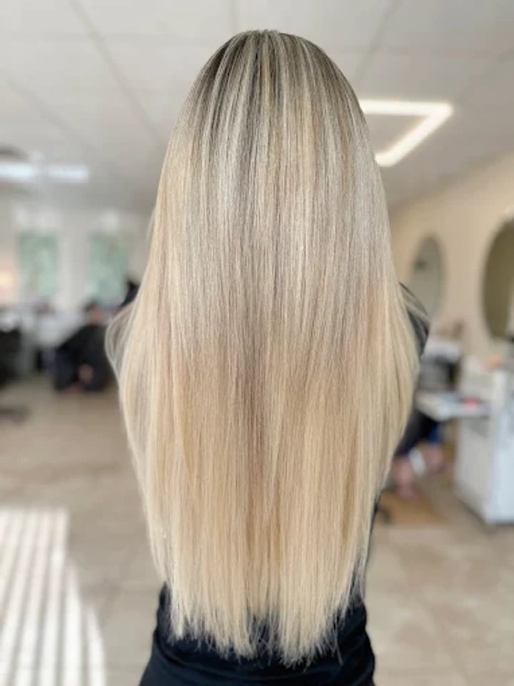 Sleek ash blonde with a soft shadow root